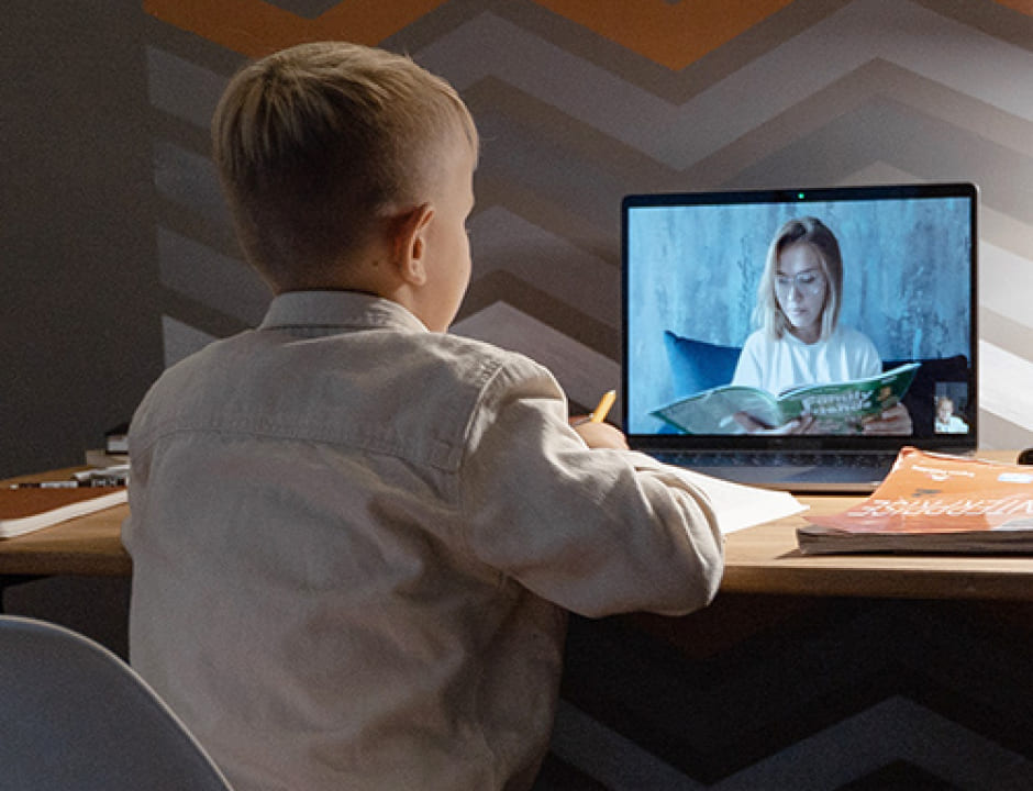 boy in virtual class with teacher