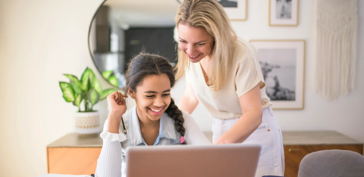 mom and girl smiling